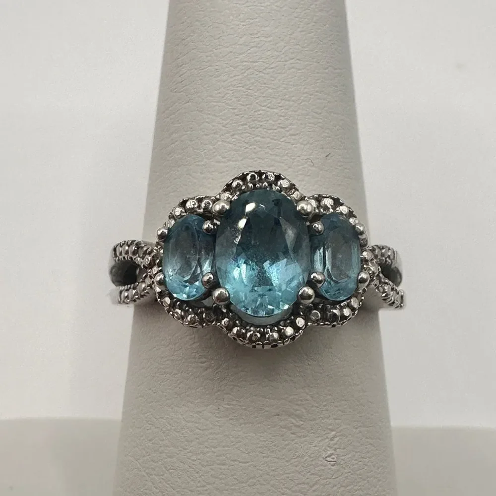 1.25ctw Swiss‎ blue topaz and genuine diamond accents in stamped .925 ring!!